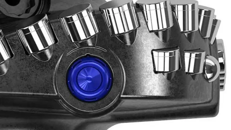 Close-up of a PDC drill bit with multiple chrome cutters and a central illuminated blue sensor element